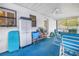 Enclosed patio with ceiling fan and dining set for outdoor enjoyment at 7016 2Nd N St, St Petersburg, FL 33702