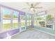 Bright sunroom with tile floor and lots of light at 7041 Daggett Ter, New Port Richey, FL 34655