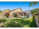 Fenced backyard with a large in-ground pool and screen enclosure at 7116 Colonial Lake Dr, Riverview, FL 33578