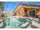 Beautiful in-ground pool with a spa, screened-in enclosure and an outdoor seating area at 7116 Colonial Lake Dr, Riverview, FL 33578