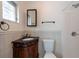 Bathroom with a shower and dark wood vanity with black marble countertop at 8008 Somerset Ln, Tampa, FL 33615