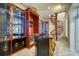 Custom bar area featuring unique display cabinets and a spiral staircase at 802 Druid S Rd, Clearwater, FL 33756