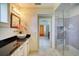Bathroom featuring mosaic tile shower, marble floor, and stylish light fixtures at 802 Druid S Rd, Clearwater, FL 33756