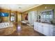 Large bathroom features marble floors, a soaking tub, and plenty of counter space at 802 Druid S Rd, Clearwater, FL 33756