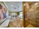 Expansive primary bathroom showcasing a jacuzzi tub, walk-in shower, vanity and access to the walk-in closet at 802 Druid S Rd, Clearwater, FL 33756
