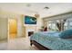 Cozy bedroom featuring a decorative fireplace, large windows, and scenic views at 802 Druid S Rd, Clearwater, FL 33756