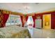 Luxury bedroom featuring a marble floor, large windows, and detailed wall coverings at 802 Druid S Rd, Clearwater, FL 33756