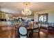 Elegant dining room with chandelier adjacent to a large open kitchen at 802 Druid S Rd, Clearwater, FL 33756