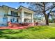 Beautiful home exterior with a large yard, balcony, and brick accents, perfect for outdoor enjoyment at 802 Druid S Rd, Clearwater, FL 33756
