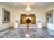 Impressive foyer with marble floors, chandelier, and elegant stairway to other levels at 802 Druid S Rd, Clearwater, FL 33756