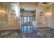 Grand foyer featuring custom shelving and glass doors leading to the outdoors at 802 Druid S Rd, Clearwater, FL 33756