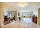 Expansive foyer with marble floors, chandelier lighting, and water view offering luxurious arrival at 802 Druid S Rd, Clearwater, FL 33756