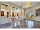 Spacious great room with marble floors, chandeliers, columns and lots of natural light at 802 Druid S Rd, Clearwater, FL 33756
