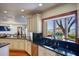 Bright kitchen showcasing wooden floors, a sink by the window, and stainless steel appliances at 802 Druid S Rd, Clearwater, FL 33756