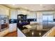 Spacious kitchen featuring white cabinets, black countertops, and stainless steel appliances at 802 Druid S Rd, Clearwater, FL 33756