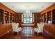 Cozy library features hardwood floors, built-in bookshelves, and a window seat with garden view at 802 Druid S Rd, Clearwater, FL 33756