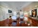 Expansive living area with hardwood floors, fireplace, and art, flowing into an open floorplan at 802 Druid S Rd, Clearwater, FL 33756