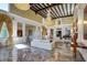 Elegant living room features chandeliers, marble floors, high ceilings, and refined decor at 802 Druid S Rd, Clearwater, FL 33756