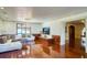 Elegant living room featuring hardwood floors, detailed trim, a chandelier, and an open layout at 802 Druid S Rd, Clearwater, FL 33756