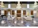 Spacious living room with marble floors, fireplace, and comfortable seating arrangement at 802 Druid S Rd, Clearwater, FL 33756