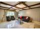 Cozy living room featuring natural light, modern lighting fixture, and comfortable seating at 802 Druid S Rd, Clearwater, FL 33756