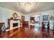 Elegant living room with a marble fireplace, hardwood floors, and sophisticated finishes at 802 Druid S Rd, Clearwater, FL 33756