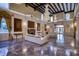 Spacious living room with marble floors, fireplace, and views of the outdoors at 802 Druid S Rd, Clearwater, FL 33756