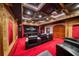 Home theater with tiered seating, a large screen, ambient lighting, and luxurious decor at 802 Druid S Rd, Clearwater, FL 33756