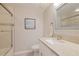 Bright bathroom featuring a shower with glass door and a granite countertop vanity at 8020 Sailboat Key S Blvd # 404, St Pete Beach, FL 33707