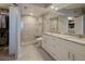 Modern bathroom with walk-in shower, double vanity, and ample storage at 8020 Sailboat Key S Blvd # 404, St Pete Beach, FL 33707