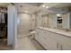 Modern bathroom featuring double sinks, granite countertops, and a spacious walk-in shower at 8020 Sailboat Key S Blvd # 404, St Pete Beach, FL 33707