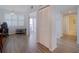 Inviting living space with wood floors, open entry, and storage closet for organized living at 8020 Sailboat Key S Blvd # 404, St Pete Beach, FL 33707