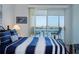 Bright main bedroom boasts water view access and carpeted floors at 8020 Sailboat Key S Blvd # 404, St Pete Beach, FL 33707