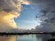 Stunning view of water and sky with a gap in the dramatic cloudscape at 8020 Sailboat Key S Blvd # 404, St Pete Beach, FL 33707