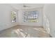 Bright, airy bedroom featuring modern flooring and an abundance of natural light at 9008 Lake Chase Island Way, Tampa, FL 33626