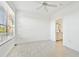 A bedroom featuring tile floors, and an ensuite bathroom at 9008 Lake Chase Island Way, Tampa, FL 33626