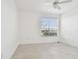 Bright bedroom with a ceiling fan and large window allowing natural light at 9008 Lake Chase Island Way, Tampa, FL 33626