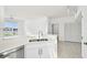 Bright kitchen featuring stainless steel appliances and a dual basin sink overlooking the backyard at 9008 Lake Chase Island Way, Tampa, FL 33626