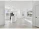 Bright, open living space with white tile floors and large windows offering ample natural light throughout at 9008 Lake Chase Island Way, Tampa, FL 33626