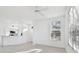 Open-concept living space featuring updated flooring and views into the modern kitchen at 9008 Lake Chase Island Way, Tampa, FL 33626