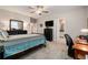 Spacious bedroom with cozy bed, a dresser, and an adjacent bathroom providing comfort and convenience at 10106 Corso Milano Dr, Tampa, FL 33625