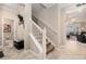 Entryway features a staircase, tile flooring, and a view into the living area at 10106 Corso Milano Dr, Tampa, FL 33625