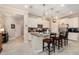 Bright kitchen with granite countertops, stainless steel appliances, and a center island with bar seating at 10106 Corso Milano Dr, Tampa, FL 33625
