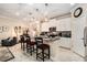 Well-lit kitchen boasts a center island with seating, stainless steel appliances, and ample counter space at 10106 Corso Milano Dr, Tampa, FL 33625