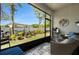 View from screened porch to landscaped backyard and white fenced yard at 10106 Corso Milano Dr, Tampa, FL 33625