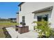 Relax in the backyard featuring a patio, barbecue, and outdoor dining set, perfect for entertaining at 11944 Miracle Mile Dr, Riverview, FL 33578