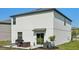 This home includes a cozy backyard with a patio and outdoor dining set, great for barbecues at 11944 Miracle Mile Dr, Riverview, FL 33578
