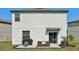 The backyard area includes a patio, grill and outdoor dining table, ideal for outdoor gatherings at 11944 Miracle Mile Dr, Riverview, FL 33578