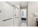 This bathroom features white tiled shower and a doorway leading into the main bedroom at 11944 Miracle Mile Dr, Riverview, FL 33578