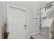 Entryway featuring a well-lit space with a staircase and decorative shelving at 11944 Miracle Mile Dr, Riverview, FL 33578